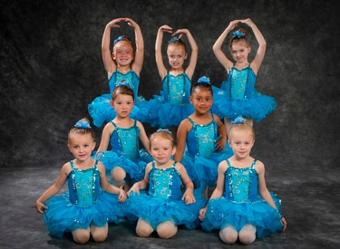 Preschool dancers in recital costumes